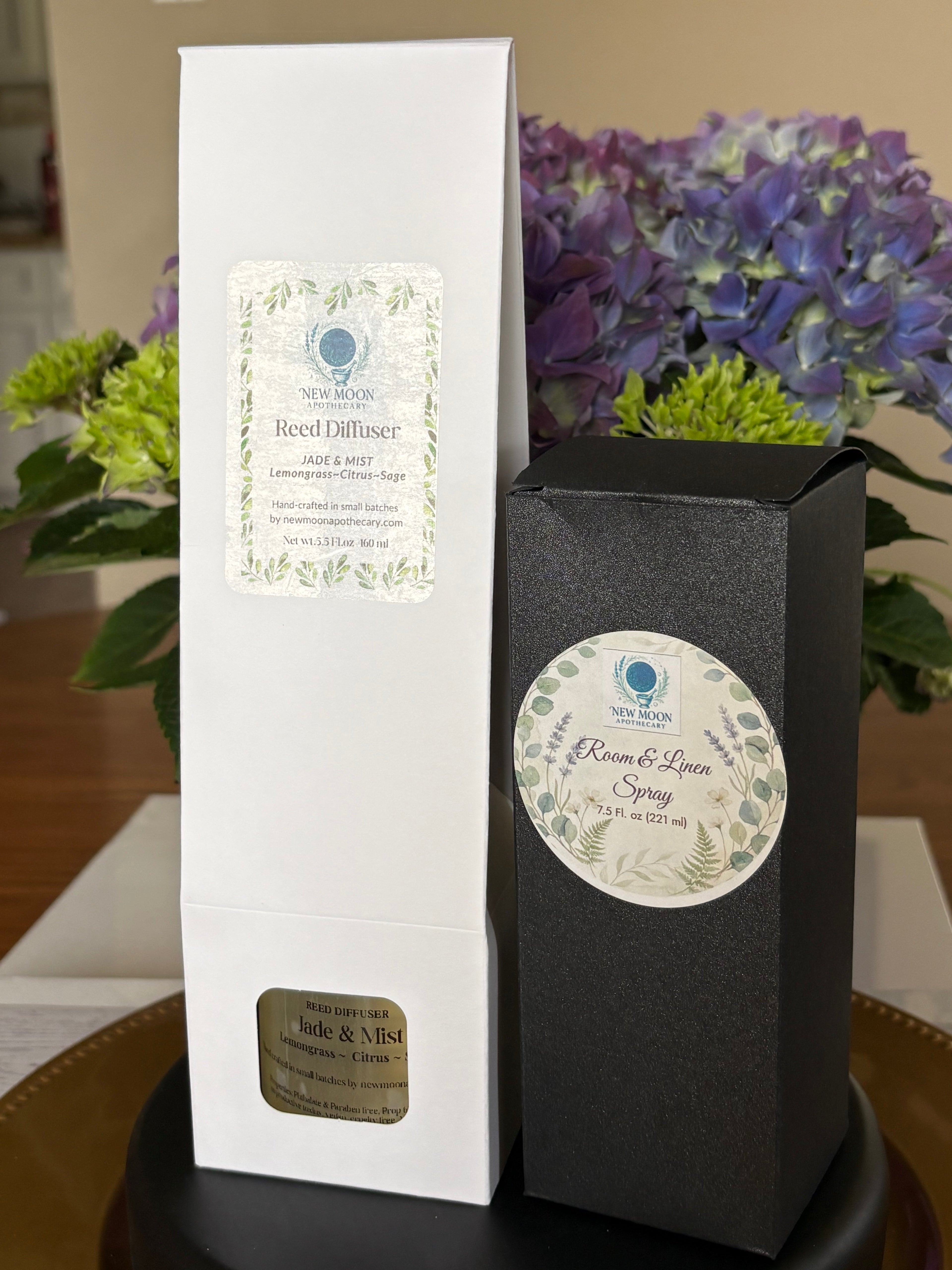Sacred Space Reed Diffuser and Room and Linen spray in white and black gift boxes with labels--Jade and Mist scent--New Moon Apothecary