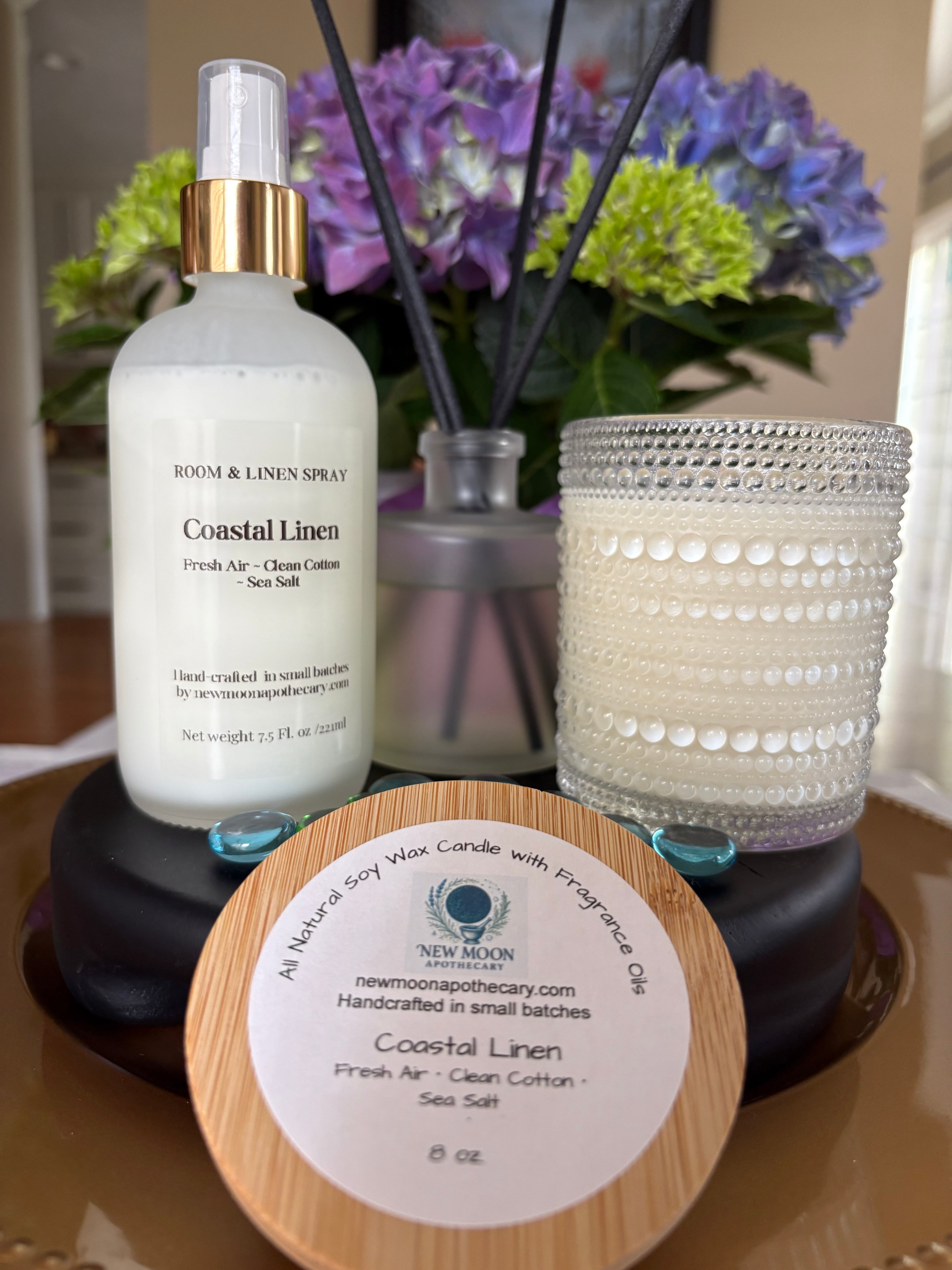 Coastal Linen fragrance room spray with reed diffuser and candle in clear glass vessel -- New Moon Apothecary 