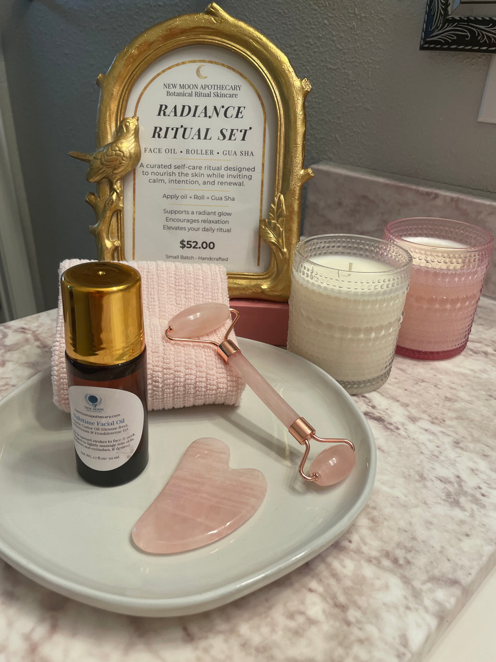 Radiant Ritual Facial oil with rose quartz roller tool and matching gua sha --New Moon Apothecary