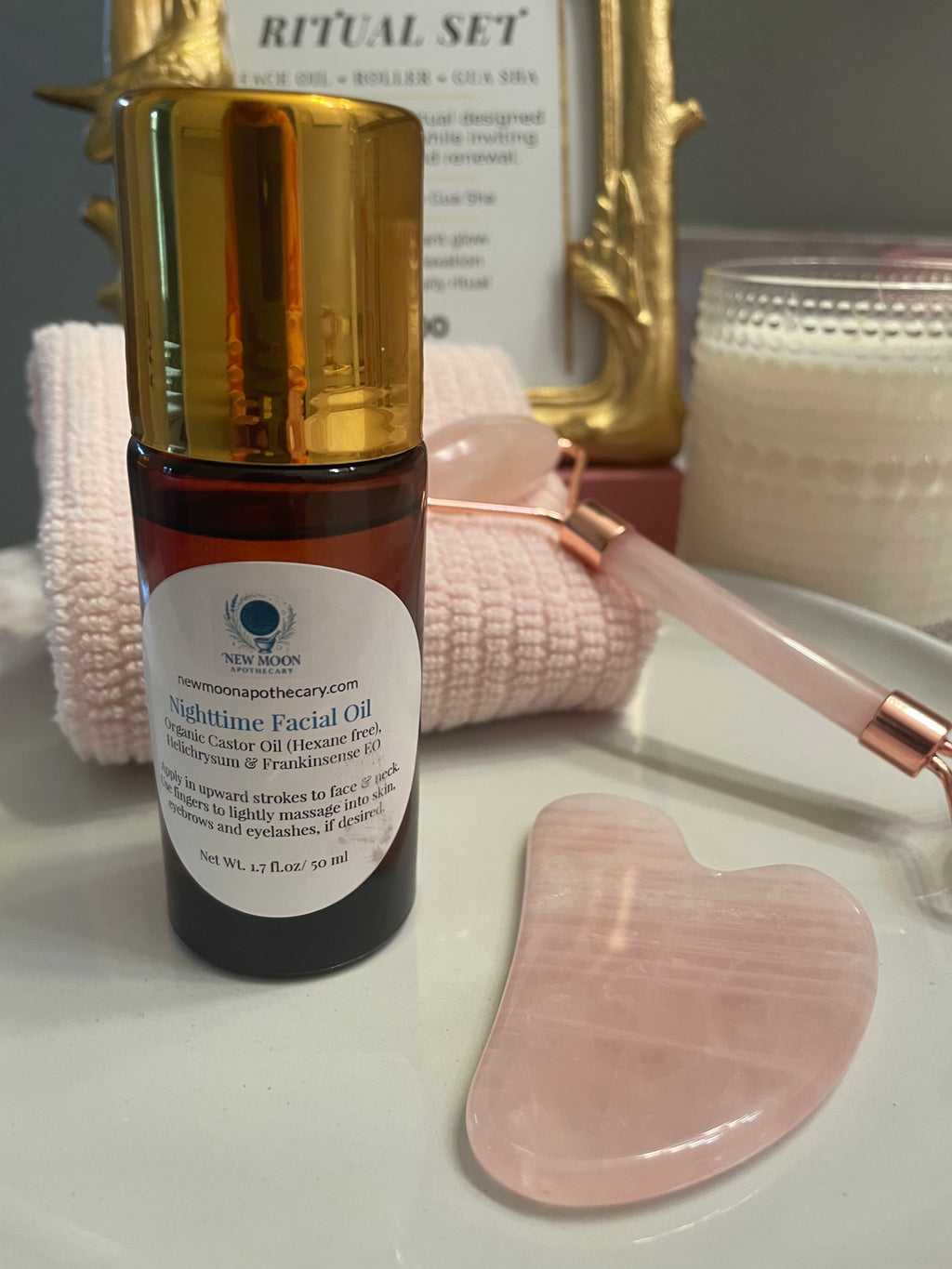 Skincare product with tools on a white surface