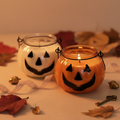 Trick or Treat candles in Clear and Orange glass jack-o-lantern vessels